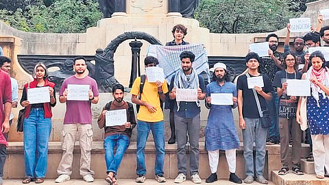 Members of civil society groups protest outside the IISc on Monday