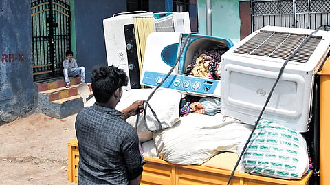 A family starts the process of shifting from the Musi riverbed on Saturday