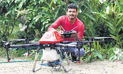 Mannar native Sameer P. with the drone that he uses to spray pesticide on the paddy field at Kuttanad in Alappuzha