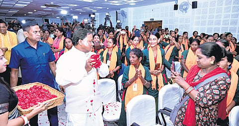 CM Mohan Charan Majhi showering flower petals on sanitation workers