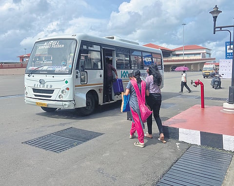 Passengers boarding a feeder bus operated by the KSBL at the Kochi airport.
