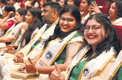 Students are all smiles as they wait to receive their degree certificates at the 27th convocation of Nimhans in Bengaluru on Thursday