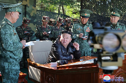 In this photo provided by the North Korean government, North Korean leader Kim Jong Un, center, visits a special operation forces unit at a western district in North Korea Wednesday, Oct. 2, 2024.
