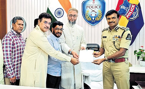 AIMIM leaders, led by Asaduddin Owaisi, hand over a representation demanding the arrest of Yati Narsinghanand, to Hyderabad Police Commissioner CV Anand on Saturday