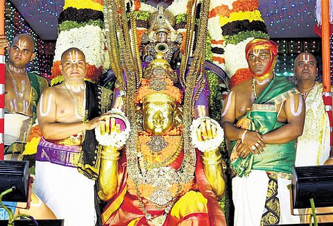 Lord Malayappa Swamy was taken out in a procession on the Garuda Vahanam on day five of the annual Bramhotsavams at Tirumala on Tuesday
