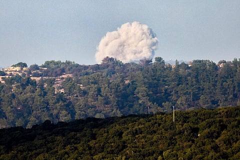 A picture taken from a position in northern Israel shows smoke billowing following Israeli bombardment on the Lebanese side of the border on October 13, 2024.