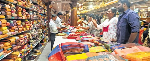 Salespersons at a textile outlet in Tiruchy