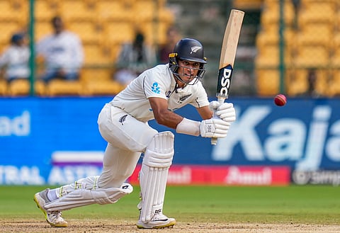 New Zealand's Rachin Ravindra plays a shot during the third day of the first cricket test match between India and New Zealand at M Chinnaswamy Stadium, in Bengaluru, Karnataka, Friday, Oct. 18, 2024.