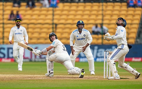 New Zealand's Will Young plays a shot during the fifth day of the first test cricket match between India and New Zealand at M Chinnaswamy Stadium, in Bengaluru