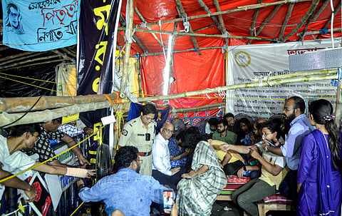 West Bengal Chief Secretary Manoj Pant and Home Secretary Nandini Chakraborty meet junior doctors who are observing fast-unto-death against the RG Kar Medical College and Hospital Rape and murder case, in Kolkata on Saturday. (