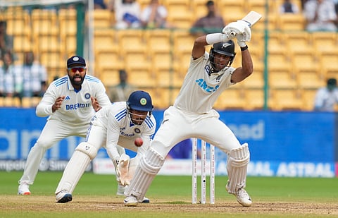 New Zealand's Rachin Ravindra plays a shot during the fifth day of the first test cricket match between India and New Zealand at M Chinnaswamy Stadium, in Bengaluru, Sunday,