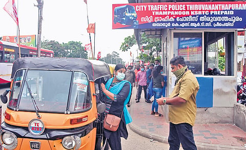 A passenger boarding an autorickshaw from the pre-paid auto counter at KSRTC Central Bus Terminal at Thampanoor on Friday