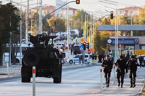 Emergency and security teams are deployed outside the Turkish state-run aerospace and defense company Turkish Aerospace Industries Inc. on the outskirts of Ankara, Turkey, Wednesday, Oct. 23, 2024.