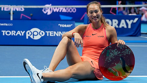 China's Zheng Qinwen poses with her trophy after winning the Pan Pacific Open women's tennis tournament at Ariake Coliseum, in Tokyo, Sunday, Oct. 27, 2024.