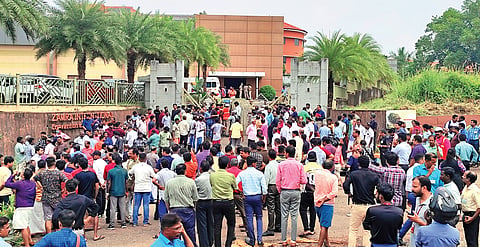 People outside the convention centre after the blast