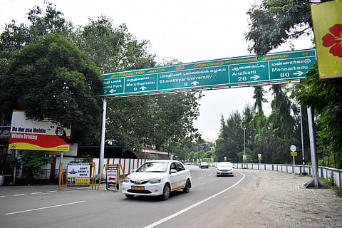 Vehicles ply on Cowley Brown road in Coimbatore on Sunday.