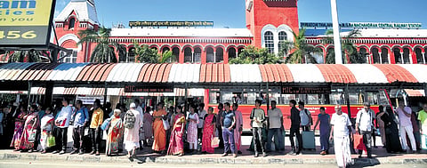 Commuters wait at the Chennai Central bus stop