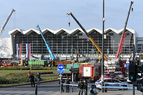 People and rescuers gather at the scene of an outdoor roof collapsed at a train station in Novi Sad, Serbia, Friday, Nov. 1, 2024.