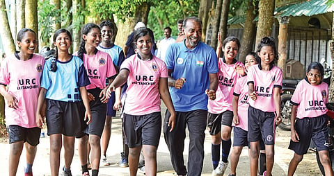 Amerzlin Louis, PE teacher at St Mary’s HS, Chellanam, with his students