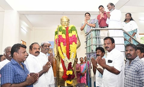 Social welfare and women empowerment minister Geetha Jeevan garlanding the statue of Italian Tamil scholar Constantine Joseph Beschi alias Veeramma Munivar at Kamanayakkanpatti near Kovilpatti.