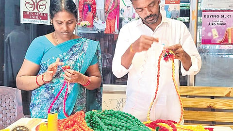 Weaver Veldi Hari Prasad and his wife make Pavitra Malalu in Rajanna-Sircilla district