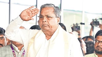 Chief Minister Siddaramaiah receives a guard of honour at Hubballi airport on Sunday