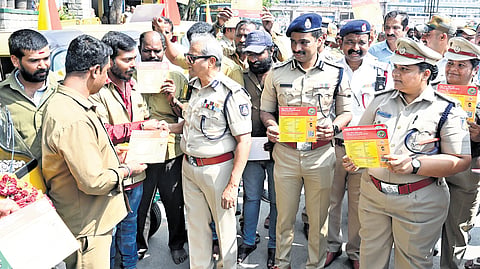 On World Public Transport Day, City Police Commissioner B Dayananda and Additional Commissioner (Traffic) MN Anuc-heth participate in a safety awareness campaign at Kempegowda Bus Station in Bengaluru on Sunday