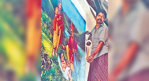 Manoj painting one of the scenes from the legend of Lord Ayyappa at Sabarimala Sannidhanam
