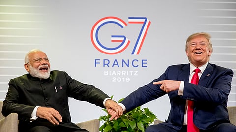 President Donald Trump and Indian Prime Minister Narendra Modi, left, share a laugh together during a bilateral meeting at the G-7 summit in Biarritz, France, Aug. 26, 2019.
