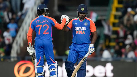 India's Sanju Samson, right, and batting partner Tilak Varma celebrate scoring runs during the fourth T20 cricket match between South Africa and India at the Wanderers Stadium in Johannesburg, South Africa, Friday, Nov. 15, 2024.