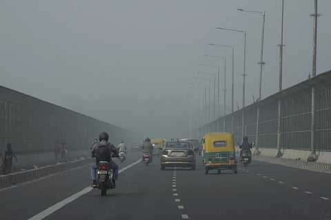 Vehicles move amid smog at Vikas Marg, in New Delhi, Friday, Nov 15, 2024.