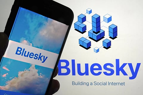 The app for Bluesky is shown on a mobile phone, left, and on a laptop screen on June 2, 2023, in New York.