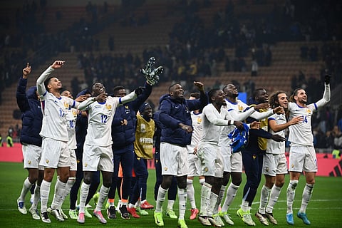 French players celebrate their victory at the end of the Nations League group A2 football match between Italy and France at San Siro stadium in Milan, on November 17, 2024.