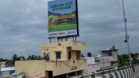 Motorists say advertisement hoardings, placed atop iron railings erected on the buildings alongside the Kavundampalayam flyover pose significant risks, especially at night.
