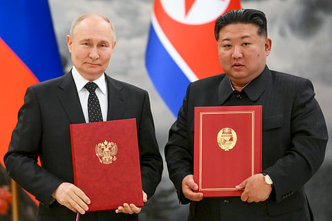 Russian President Vladimir Putin, left, and North Korea's leader Kim Jong Un pose for a photo during a signing ceremony of the new partnership in Pyongyang, North Korea, on June 19, 2024.