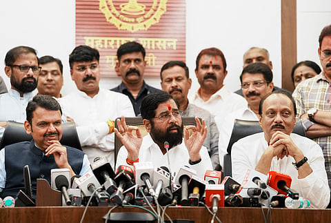 Maharashtra Chief Minister Eknath Shinde with Deputy Chief Ministers Devendra Fadnavis and Ajit Pawar addresses a press conference as the BJP-led Mahayuti alliance secures victory amid the counting of votes for the Maharashtra Assembly elections, in Mumbai, Saturday, Nov. 23, 2024.