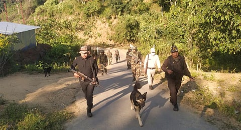 Security personnel during a search operation in the fringe and vulnerable areas of hill and valley districts of Manipur.