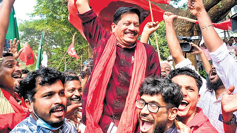 CPM workers celebrate with U R Pradeep after the declaration of results