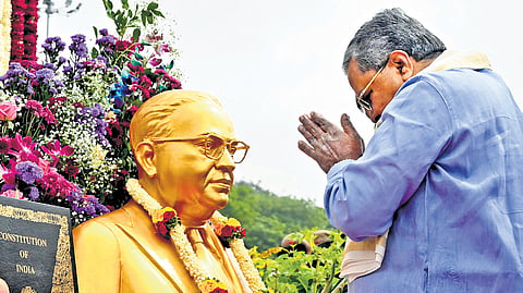 Chief Minister Siddaramaiah pays tributes to Dr BR Ambedkar to mark 75th Constitution Day in front of Vidhana Soudha in Bengaluru on Tuesday