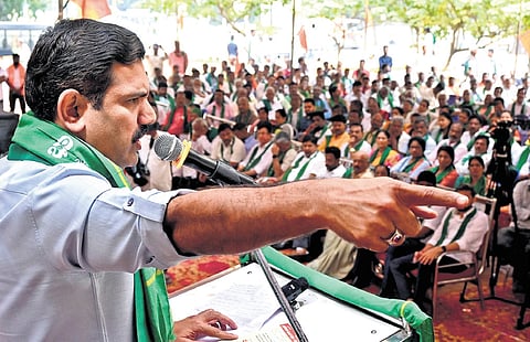 State BJP president BY Vijayendra addresses members of the Bharatiya Kisan Morcha who are protesting over the Waqf land issue, at Freedom Park in Bengaluru on Tuesday