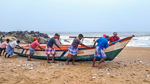 Fishermen move a boat to a harbour amidst a warning issued by the India Meteorological Department (IMD) that a deep depression over the southwest Bay of Bengal is likely to intensify into Cyclone 'Fengal' and move towards Tamil Nadu, in Mayiladuthurai, Tamil Nadu, Wednesday, Nov. 27, 2024.