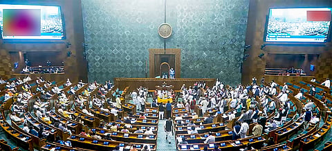 Opposition MPs protest over Adani and 'Sambhal issues in Lok Sabha during the Winter Session of Parliament in New Delhi.