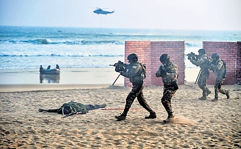 MARCOS display their extraordinary combat skills during Indian Navy’s Operational Demonstrations at Blue Flag Beach, in Puri on Wednesday