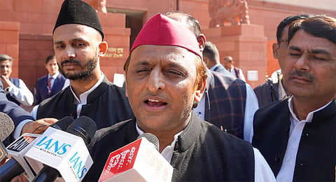 Samajwadi Party Chief Akhilesh Yadav talks with media during the Winter session of Parliament, in New Delhi, Wednesday, Dec. 4, 2024.