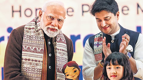 PM Narendra Modi being felicitated by a child during the ‘Ashtalakshmi Mahotsav’ at the Bharat Mandapam in New Delhi on Friday.