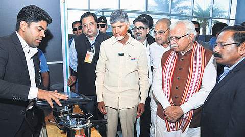 Chief Minister N Chandrababu Naidu and Union Minister for Power Manohar Lal Khattar observing the energy efficient appliances at Urjaveer programme