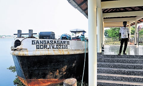 A dredger, arranged to remove silt has been idling at the Mattancherry boat jetty for the past two weeks. A scene on Sunday