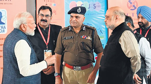 Prime Minister Narendra Modi and Union Home Minister Amit Shah speak with DGP Surendra Yadav at an exhibition in Chandigarh.