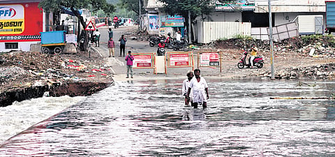 Overflowing water due to downpour have submerged Padikuppam bridge in Chennai