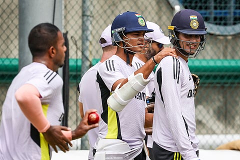 India's Yashasvi Jaiswal (L) talks with teammate Shubman Gill during a training session at the Gabba (Photo | AFP)